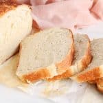 View on a sourdough discard sandwich bread sliced on parchment paper.