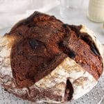 View on a sourdough chocolate bread cooling down on a cooling rack.