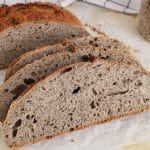 Showing a pile of slices of sourdough buckwheat bread.