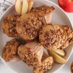 A few vegan sourdough apple muffins on a plate.