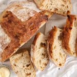 View on a sliced sourdough onion bread on a hand towel.
