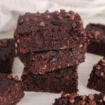 Squares of vegan kidney bean brownies over each other.