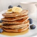 Stack of eggless pancakes made with oats and sourdough.
