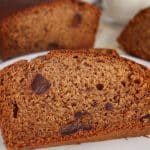 A slice of vegan date cake with pieces of date inside the crumb.