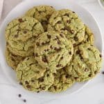 Vegan chocolate chip matcha cookies on a white plate.
