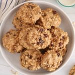 A plate filled with Vegan Oat and Raisin Protein Cookies.