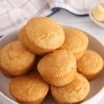 A white plate with sourdough corn muffins.