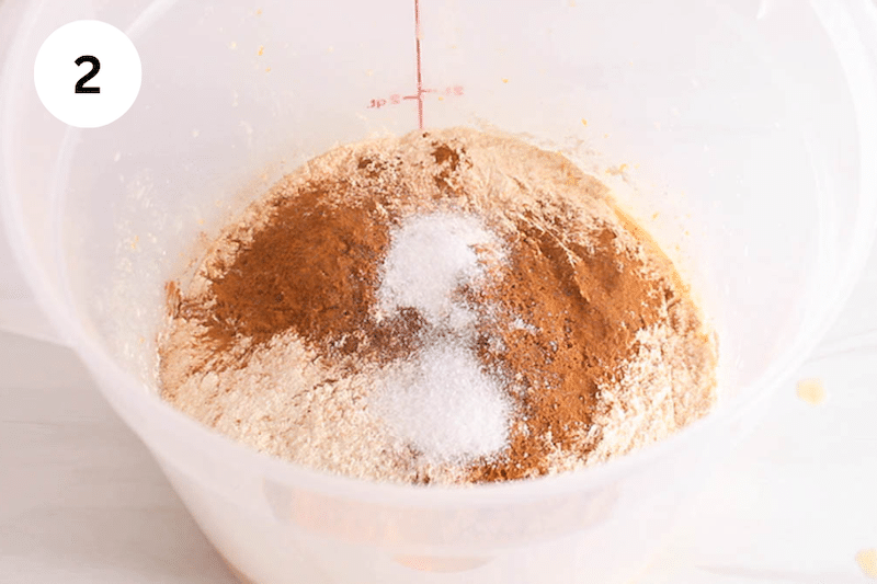 Flour, cinnamon and salt in a large plastic container.