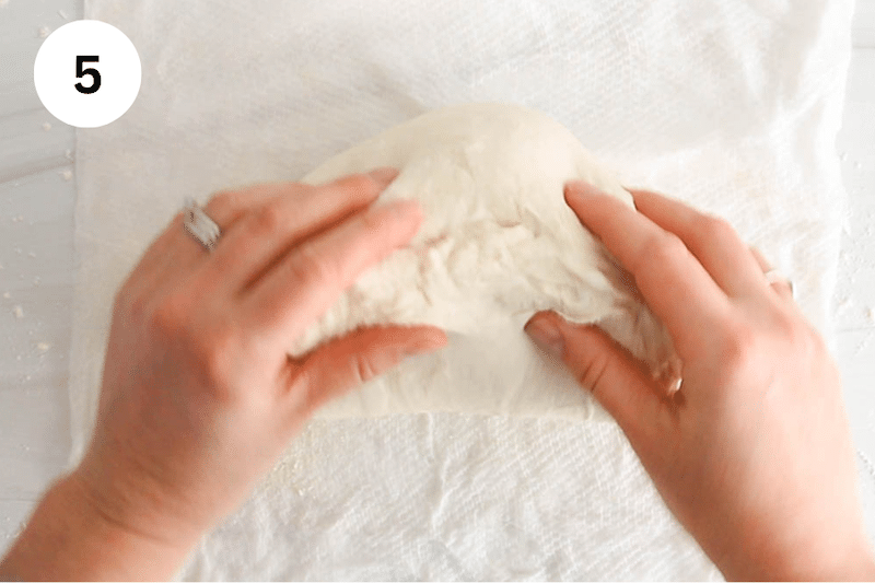 Dough rolling over a wet towel.