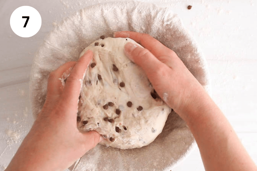 Hand placing a sourdough in a baneton.